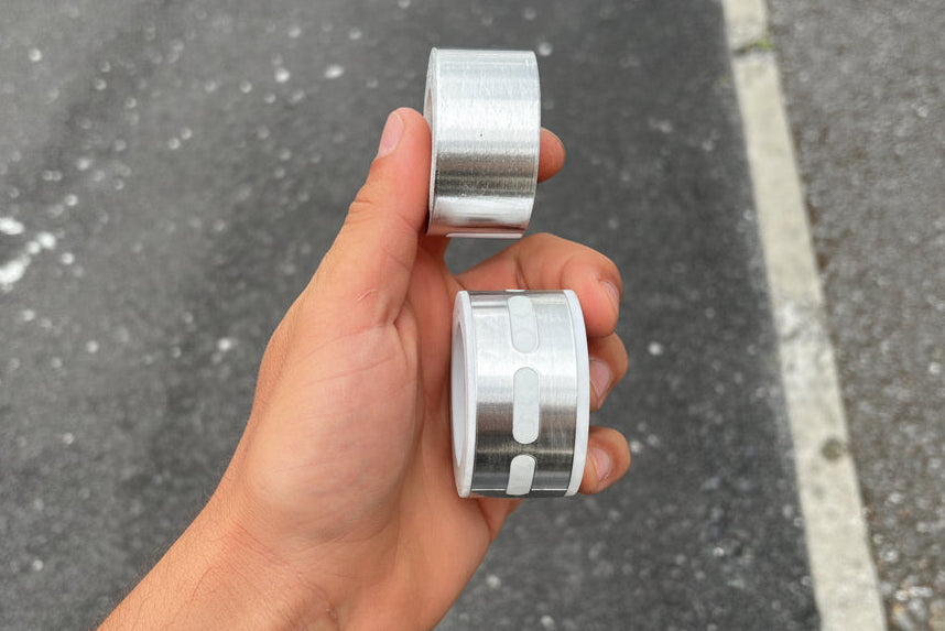 High-quality aluminum foil sealing tape roll for polycarbonate sheets and greenhouse sealing applications, shown in a horizontal professional studio product shot with clean white background.