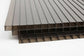 Bronze tinted twin wall polycarbonate roofing sheets stacked — 
heat-reducing tinted panels for pergolas and patio canopies Ireland
