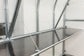 Galvanised steel hanging shelf with chain suspension inside arc polycarbonate 
greenhouse — greenhouse staging with chain support and steel frame Ireland